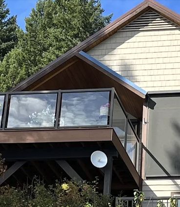 New roofline and metal trim over a covered deck